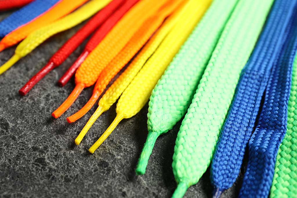 How can brightly coloured shoelaces transform an outfit?